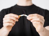 close up of man breaking the cigarette with hands